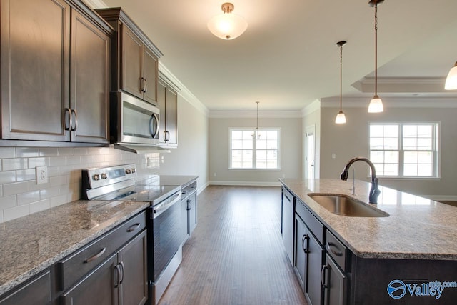 108 Ivy Vine Dr, Toney, AL 35773 - kitchen featuring appliances with stainless steel finishes, a sink, ornamental molding, tasteful backsplash, and baseboards