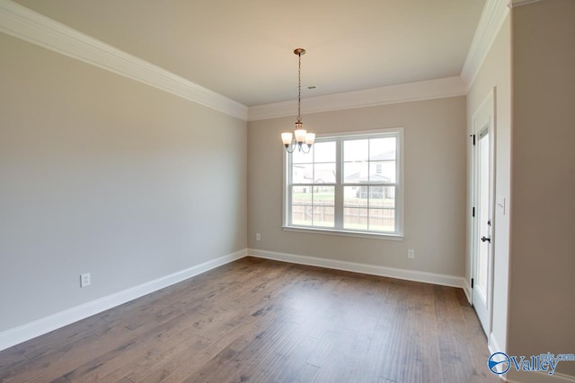 108 Ivy Vine Dr, Toney, AL 35773 - unfurnished room with crown molding, dark wood-type flooring, baseboards, and a chandelier