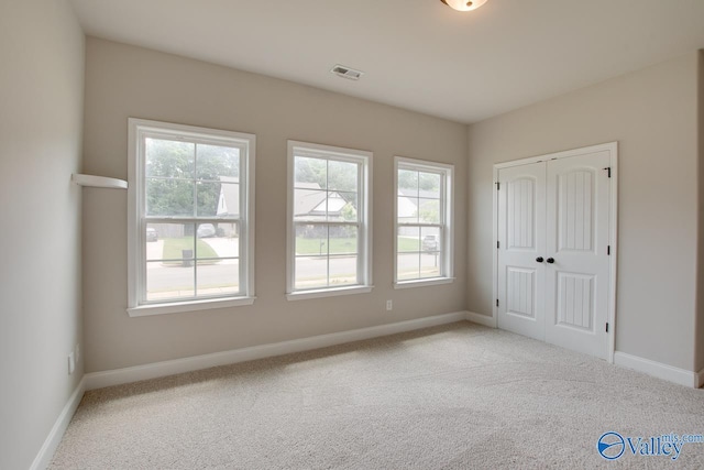 108 Ivy Vine Dr, Toney, AL 35773 - unfurnished bedroom featuring carpet flooring, multiple windows, and baseboards
