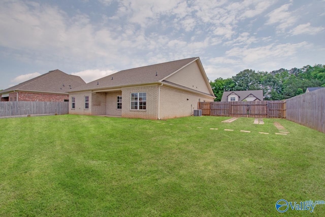 108 Ivy Vine Dr, Toney, AL 35773 - back of property featuring brick siding and central AC