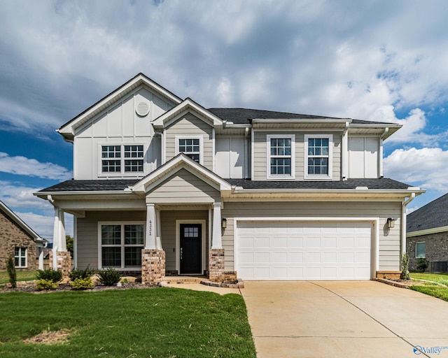 craftsman-style home with a front lawn and a garage