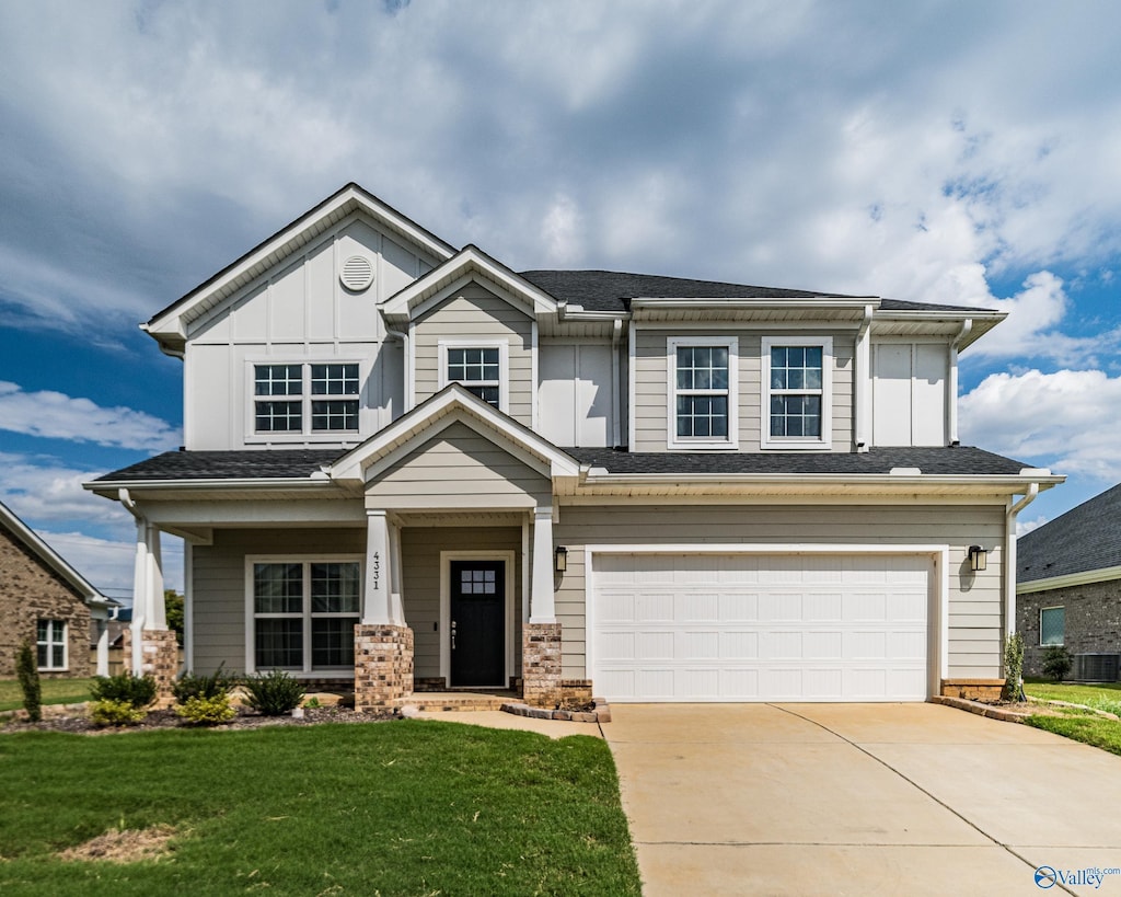 4331 Willow Bend Rd SE, Owens Cross Roads, AL 35763 - craftsman house featuring a front lawn, driveway, an attached garage, and board and batten siding