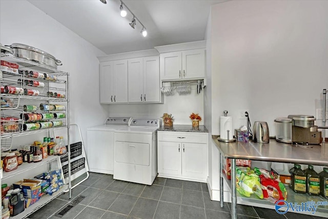 laundry room with cabinets and separate washer and dryer