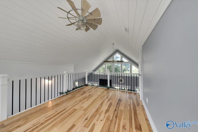 additional living space with wooden ceiling, ceiling fan, wood-type flooring, and vaulted ceiling