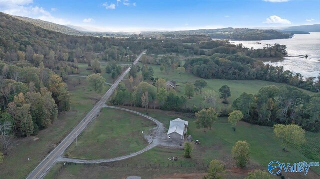 drone / aerial view with a water and mountain view