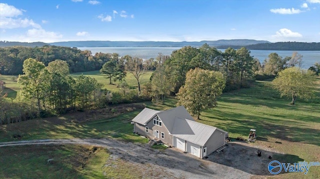 birds eye view of property featuring a water and mountain view