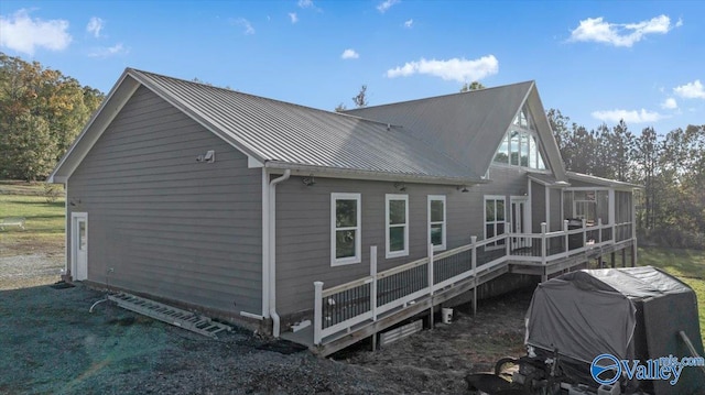 view of side of property with a deck