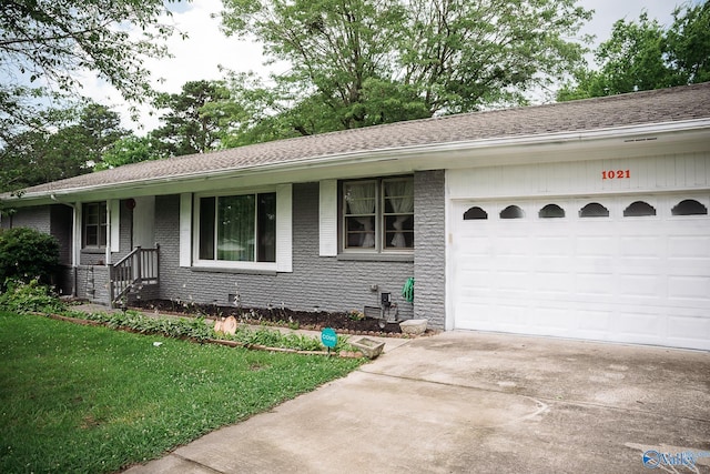 1021 NW 9th St NW, Arab, AL 35016 - single story home with concrete driveway, brick siding, a front lawn, a garage, and a shingled roof