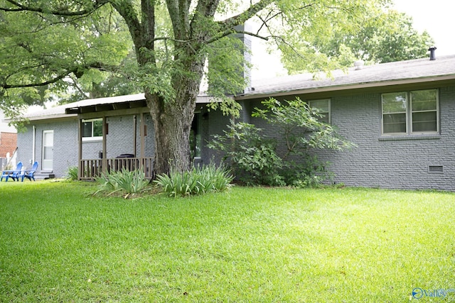 1021 NW 9th St NW, Arab, AL 35016 - view of front of home with brick siding and a front lawn