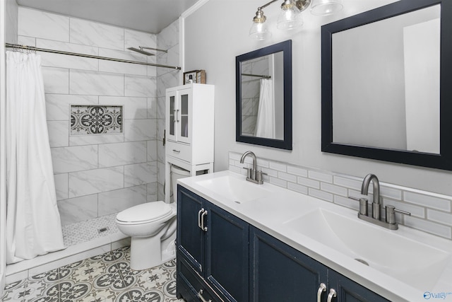 bathroom featuring a shower with shower curtain, vanity, and toilet