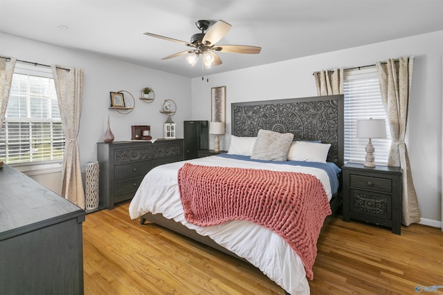 bedroom featuring wood-type flooring and ceiling fan