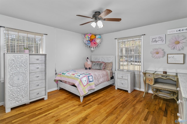 bedroom featuring ceiling fan and light hardwood / wood-style floors