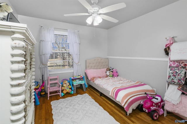 bedroom featuring ceiling fan and dark hardwood / wood-style floors