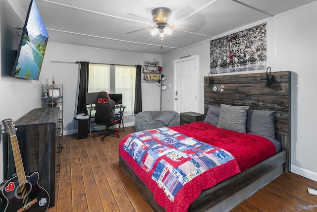 bedroom with ceiling fan and dark wood-type flooring