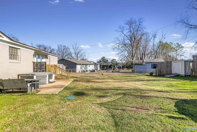 view of yard featuring a patio area and a shed