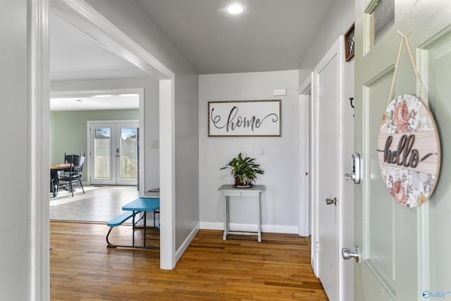 corridor featuring french doors and hardwood / wood-style floors