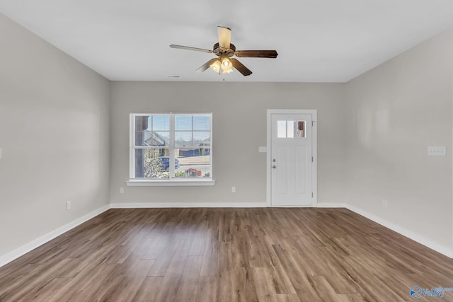 interior space featuring hardwood / wood-style floors and ceiling fan