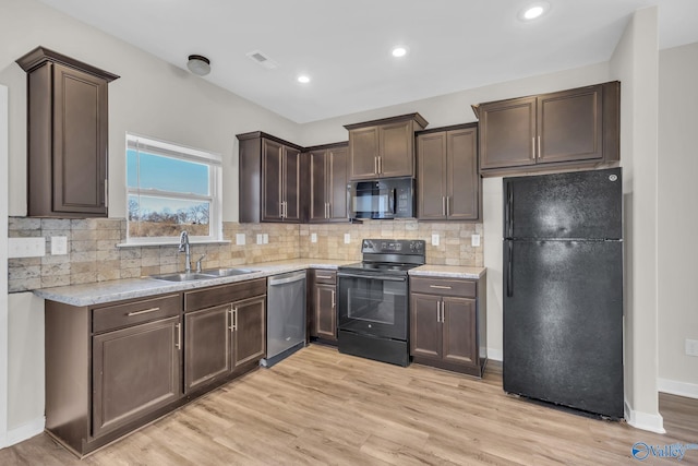 kitchen with sink, light hardwood / wood-style flooring, tasteful backsplash, dark brown cabinetry, and black appliances