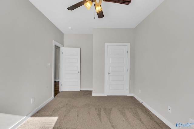 unfurnished bedroom featuring a closet, ceiling fan, and carpet flooring