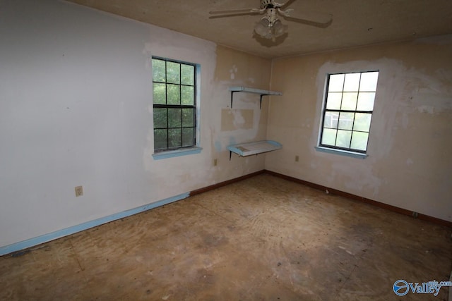 unfurnished room with a wealth of natural light and ceiling fan