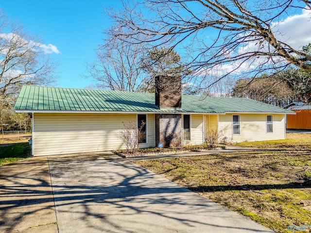 ranch-style house featuring a garage