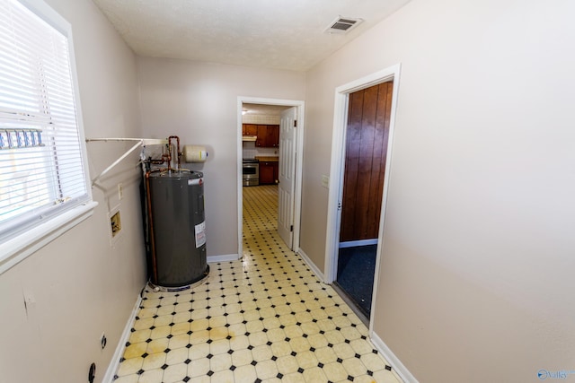 laundry area featuring electric water heater