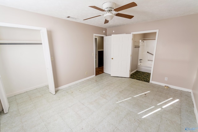 unfurnished bedroom with ceiling fan and ensuite bath