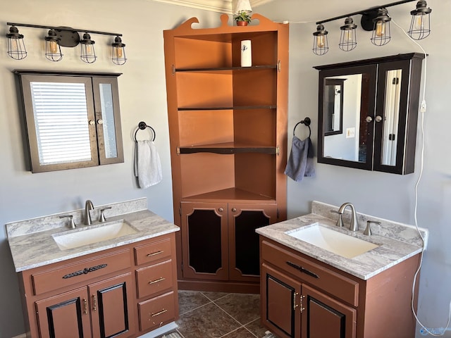 full bathroom with two vanities, a sink, and tile patterned floors