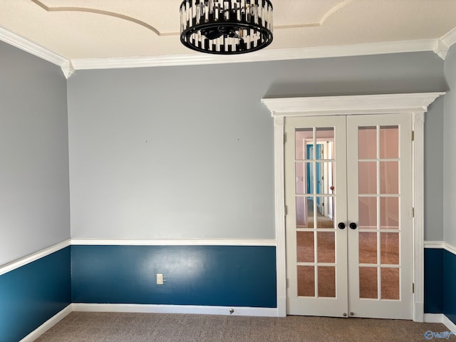 interior space featuring french doors, crown molding, and baseboards