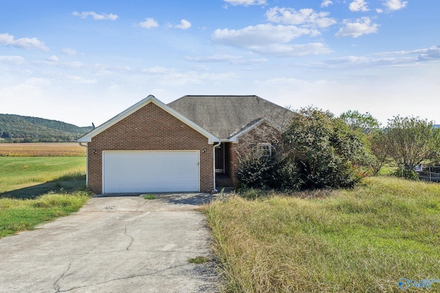 single story home featuring a garage and a mountain view