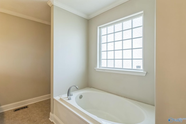 bathroom featuring ornamental molding, tile patterned floors, and a bathing tub