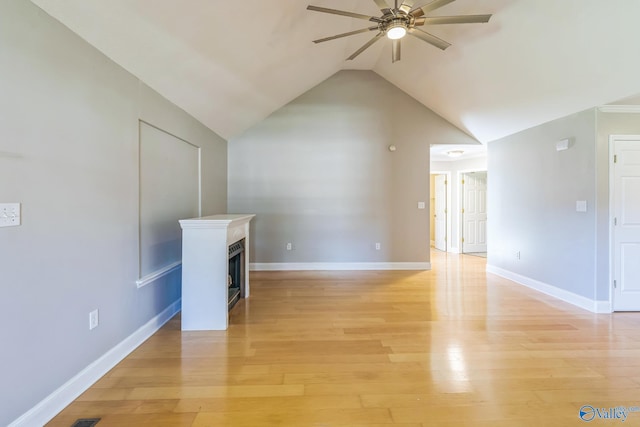 additional living space with light hardwood / wood-style flooring, lofted ceiling, and ceiling fan