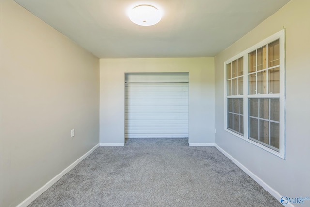 unfurnished bedroom with carpet floors