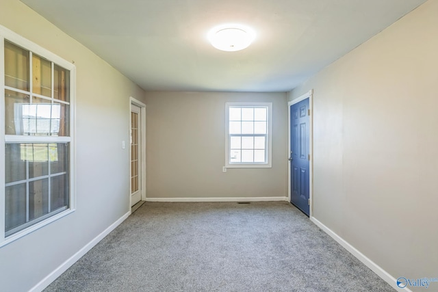 unfurnished room with carpet