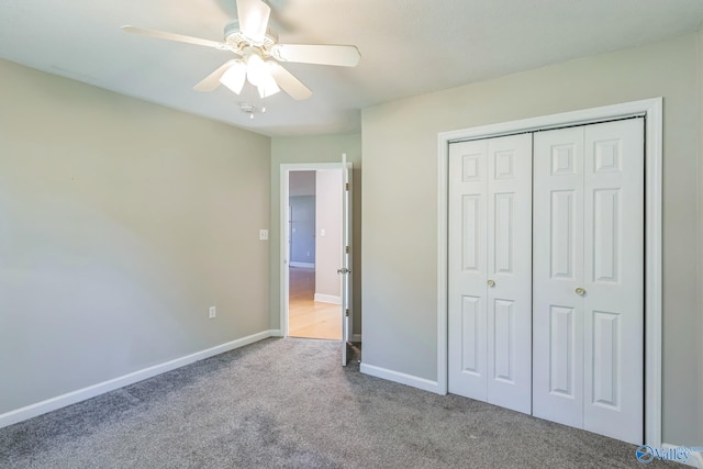 unfurnished bedroom with light carpet, a closet, and ceiling fan