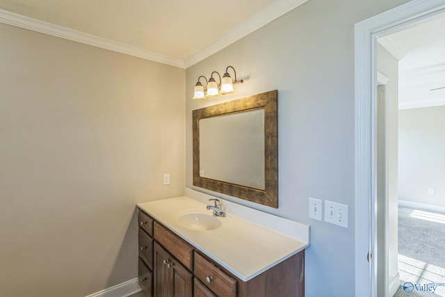 bathroom with crown molding and vanity