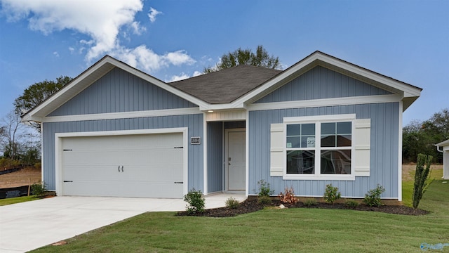 view of front facade featuring a garage and a front lawn