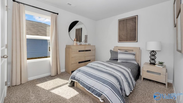 bedroom featuring light carpet