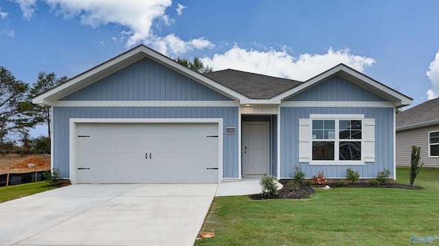 view of front of house featuring a garage and a front yard