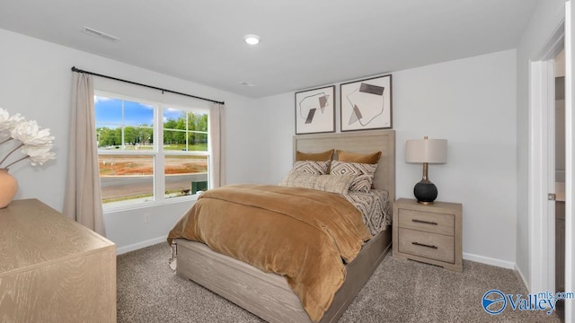 bedroom featuring light carpet