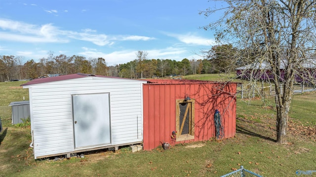 view of outbuilding featuring a lawn