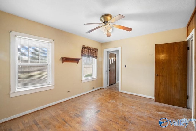 unfurnished room with light hardwood / wood-style floors and ceiling fan