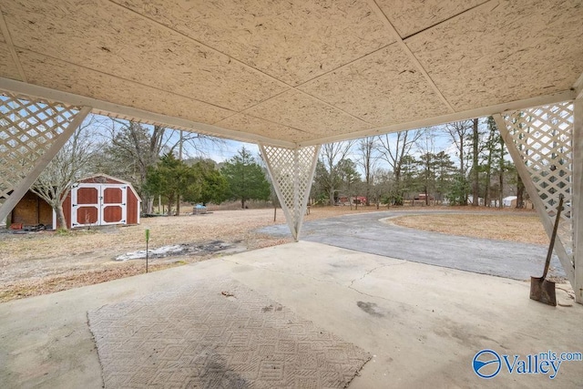 view of patio / terrace featuring a storage shed