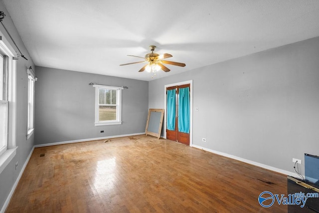 empty room featuring ceiling fan and wood-type flooring