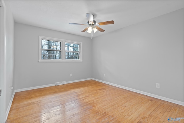 empty room featuring light hardwood / wood-style flooring and ceiling fan