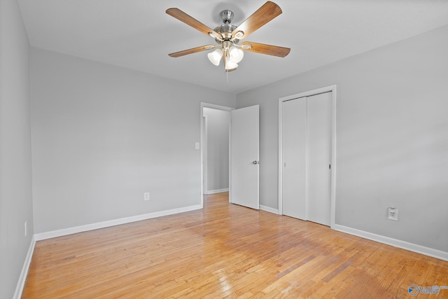 unfurnished bedroom featuring a closet, ceiling fan, and light wood-type flooring