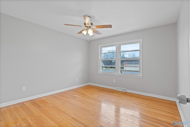 spare room with light hardwood / wood-style flooring and ceiling fan