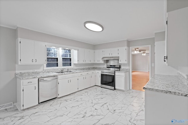 kitchen featuring sink, ceiling fan, appliances with stainless steel finishes, ornamental molding, and white cabinets