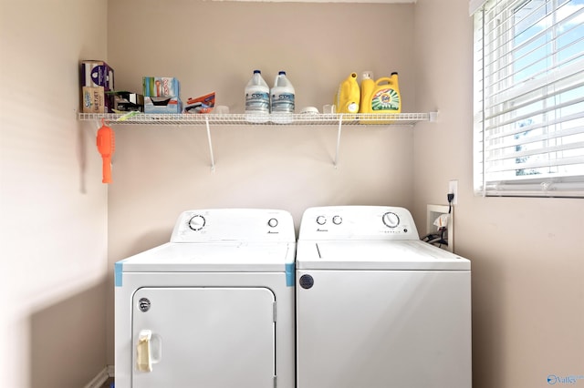 washroom featuring washing machine and dryer