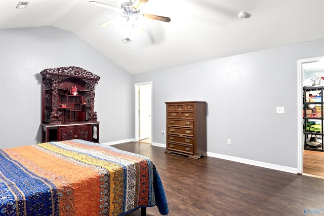 bedroom featuring ceiling fan, dark hardwood / wood-style flooring, and vaulted ceiling